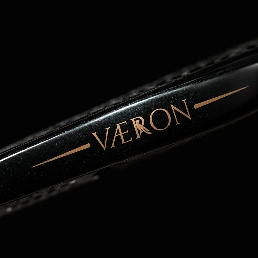 The VÆRON wordmark printed in gold on the frame edge